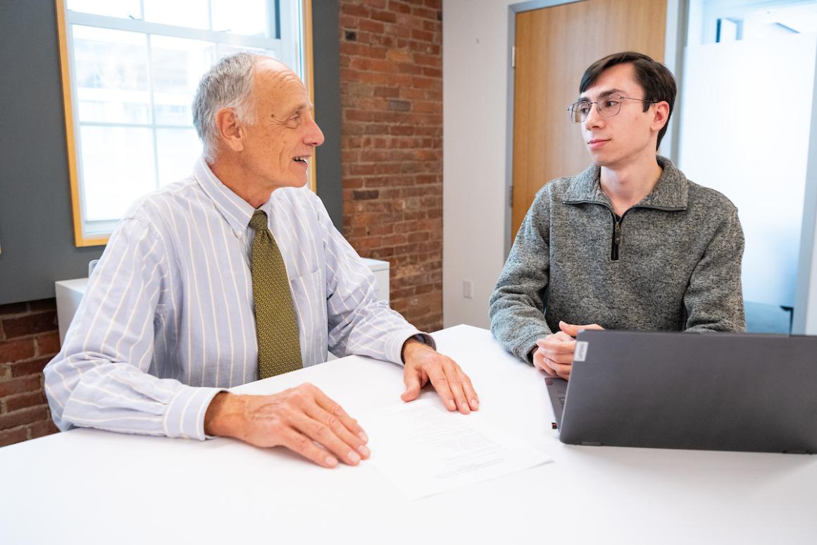 George Ellmore, Professor of Biology, and Michael Kourkoulakos, AG25, Masters candidate in Biology, pose for a photograph of an advising session 