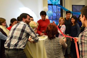 Students celebrate the opening of the Curtis Hall graduate student lounge