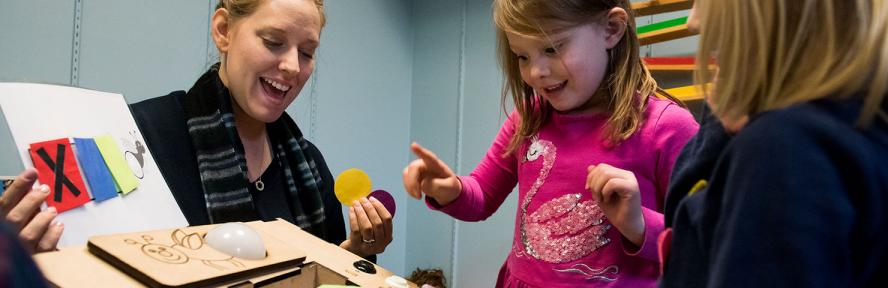 Amanda Strawhacker works with local children on a research study at the Boston Museum of Science