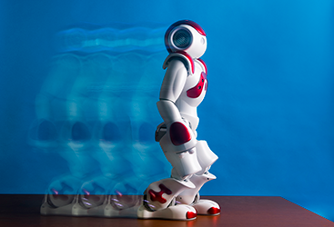 A robot walks in the Human-Robot Interaction Lab.