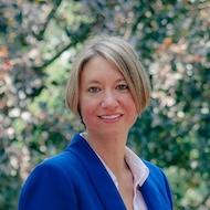 Erin in blue blazer and white shirt