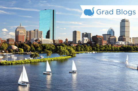 Image of Boston harbor with sailboats and skyline in background